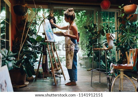 Similar – Image, Stock Photo Female artist drawing with pencil in art studio