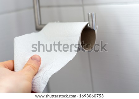 Image, Stock Photo Man grabs the toilet paper on the toilet