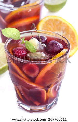 Ice refreshing summer drink with lots of different fruits