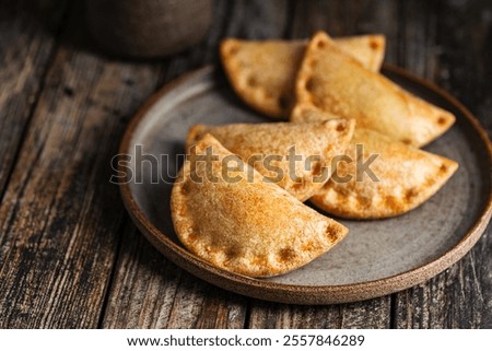 Similar – Image, Stock Photo Tasty stuffed savory pastry pie with phyllo dough in traditional baking pan. Balkan or oriental cuisine. Börek