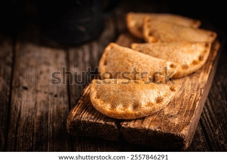 Similar – Image, Stock Photo Tasty stuffed savory pastry pie with phyllo dough in traditional baking pan. Balkan or oriental cuisine. Börek