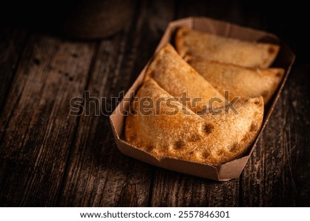 Similar – Image, Stock Photo Tasty stuffed savory pastry pie with phyllo dough in traditional baking pan. Balkan or oriental cuisine. Börek