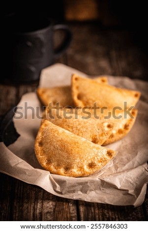 Similar – Image, Stock Photo Tasty stuffed savory pastry pie with phyllo dough in traditional baking pan. Balkan or oriental cuisine. Börek