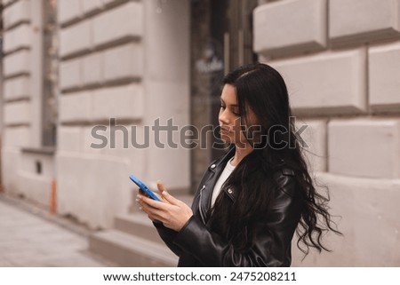 Similar – Image, Stock Photo Serious woman browsing smartphone at home