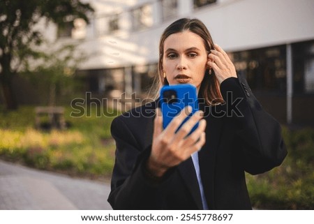 Similar – Image, Stock Photo Woman fixing hair near mirror in restroom