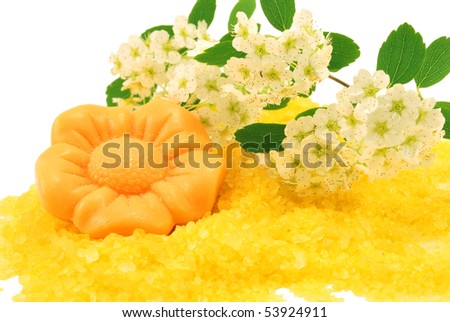 flower soap over bath salt isolated on white