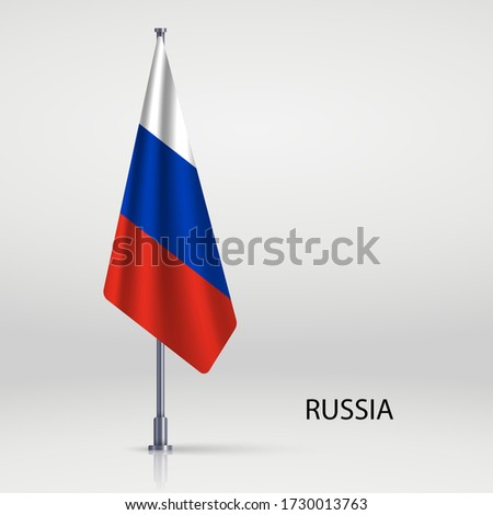 Russia hanging flag on flagpole