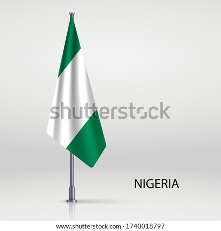 Nigeria hanging flag on flagpole