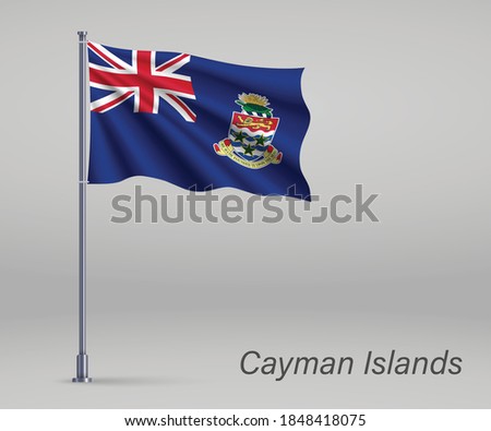 Waving flag of Cayman Islands - territory of United Kingdom on flagpole. Template for independence day