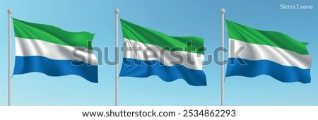 Set of three flags of Sierra Leone waving on flagpoles with a vibrant blue sky backdrop.