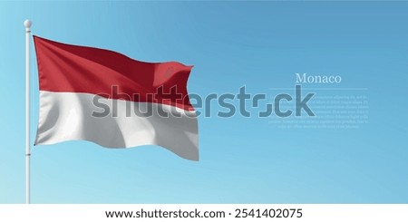 Waving flag of Monaco on a pole with a blue sky backdrop with copyspace