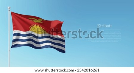 Waving flag of Kiribati on a pole with a blue sky backdrop with copyspace