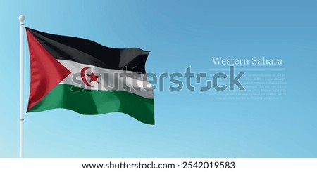 Waving flag of Western Sahara on a pole with a blue sky backdrop with copyspace