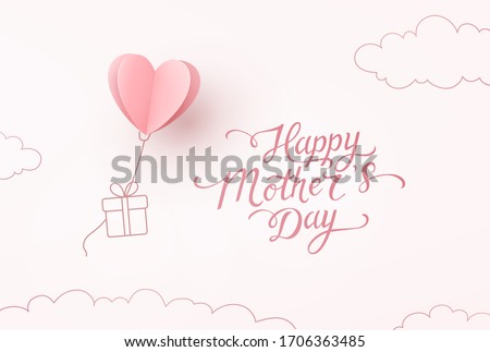 Mother's day greeting card. Vector flying heart balloon with gift box and Happy Mother's Day calligraphy on pink sky background