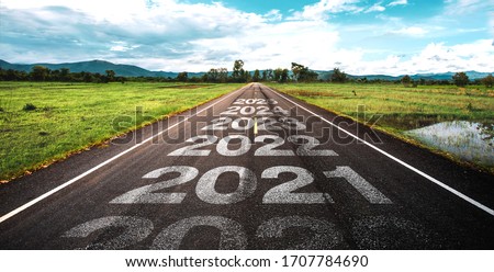 2020-2025 written on highway road in the middle of empty asphalt road  and beautiful blue sky. Concept for vision 2021-2025.
