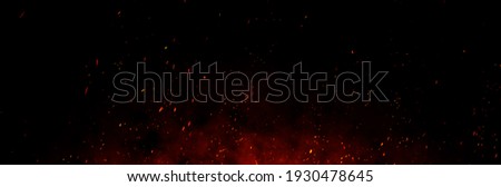 Fire embers particles over black background. Fire sparks background. Abstract dark glitter fire particles lights. bonfire in motion blur. Stock foto © 