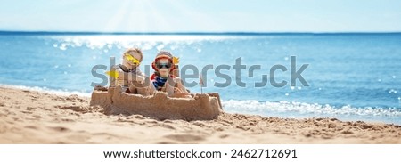 Similar – Image, Stock Photo Little girl building sand castle on beach