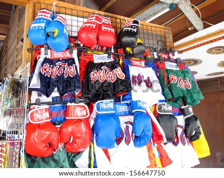 PATTAYA, THAILAND - FEBRUARY 24: Thai boxing pants and Thai boxing gloves, one of the most famous culture of Thailand in present, displayed at the shop on February 24, 2013 in Pattaya, Thailand.