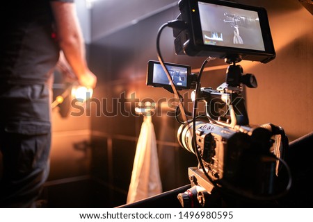 Behind the scenes of filming films or video products and the film crew of the film crew on the set in the pavilion of the film studio.