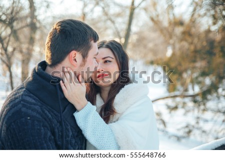 Young Couple In Love Walking On The Snowy Woods. Romance, Kisses, Love ...