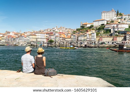 Similar – Image, Stock Photo two women sightseeing Porto views by the river and taking picture with mobile phone. Travel and friendship concept