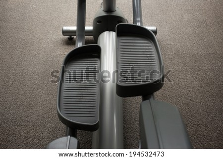 Elliptical cross trainer machine in exercise room for sport