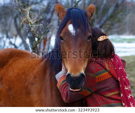 Portrait woman and horse in outdoor. Woman hugging a horse and horse tongue out