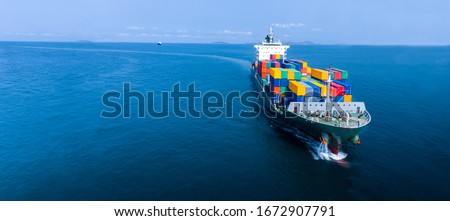 Aerial in front of cargo ship carrying container and running for export  goods  from  cargo yard port to custom ocean concept freight shipping by ship . Zdjęcia stock © 