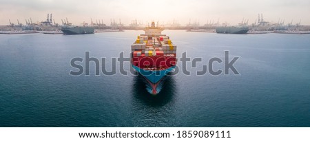 Aerial in front of cargo ship carrying container and running 
near international custom depot sea port concept smart logistic service.