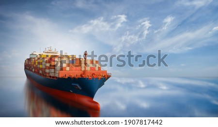 Aerial side view of smart cargo ship carrying container from custom container depot go to ocean concept freight shipping by ship service on blue sky background.