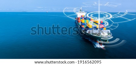 Aerial in front of cargo ship with smart circle line technology and WIFI technology , large ship carrying container and running for export  goods  from  cargo yard port to custom .