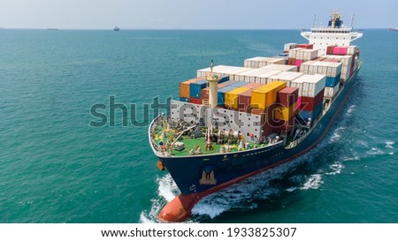 Aerial side view of smart cargo ship carrying container from custom container depot go to ocean concept freight shipping by ship service on blue sky background. Сток-фото © 