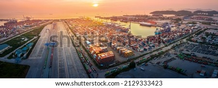 The International cargo container depot at sunset , multiple supply chain truck train and cargo ship working service shipping and transportation concept logistic and transport. ストックフォト © 