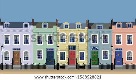 Colorful city house facades on a sunny street.