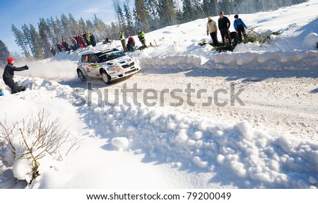 HAGFORS, SWEDEN - FEB 13: Per-Gunnar Andersson ,driving his Skoda SWRC during  Rally Sweden 2010 in Hagfors, Sweden on February 13, 2010.  SWRC and Swedish Championship winner Rally Sweden 2010