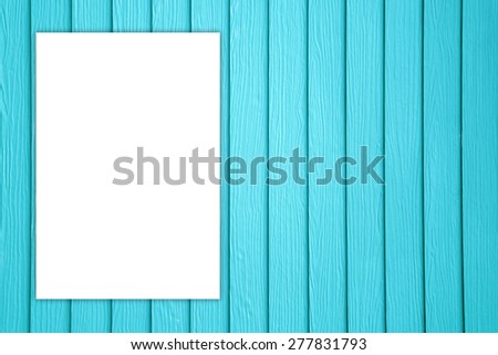 White blank on blue wooden background.