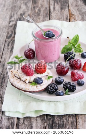 Healthy breakfast with dietary rice waffles, berry yogurt and fresh berries.Selective focus.