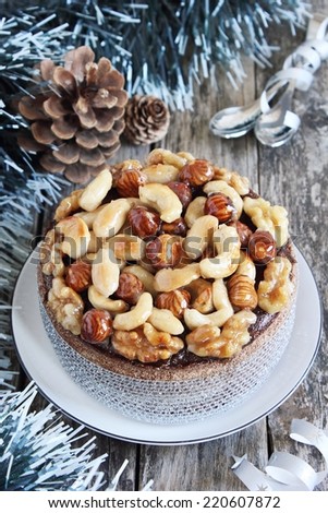 Christmas cake with caramelized nuts,chocolate and spices.Traditional dessert.