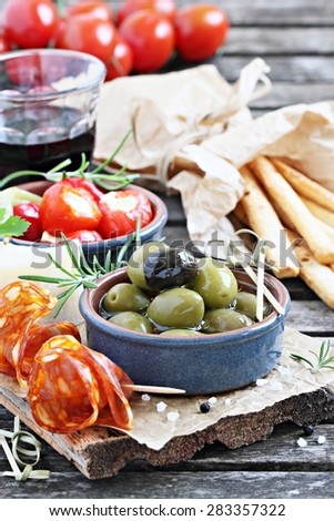 Antipasto appetizer on a wooden table.Selective focus.