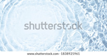 Splash cosmetic moisturizer water micellar toner or emulsion  blue colored abstract background Stock foto © 