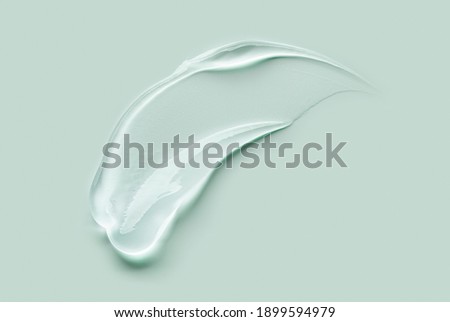 Liquid gel cosmetic smudge drops texture green grey background  Stock foto © 