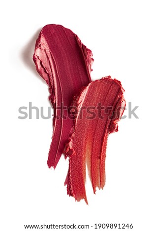Lipstick abstract strokes smudge  background texture mulberry plum and vinous red colored on beige background Photo stock © 