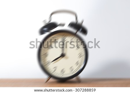 Come on - time to wakeup and hurry for work. It\'s eight o\'clock already. A blur effect is applied on the bells to emphasize the wakening.