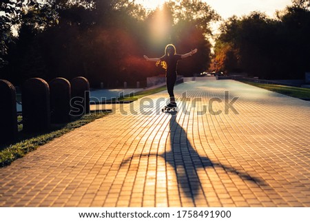 Similar – Image, Stock Photo Trendy skater keeping balance standing on skateboard