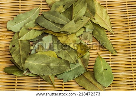 Dried bay leaves or laurel on a woven bamboo/ Bay Leaves