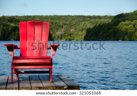 Red Wood Chair on Docks at Cottage Lake