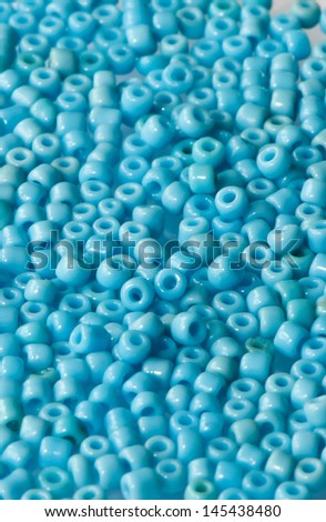background of small blue plastic beads