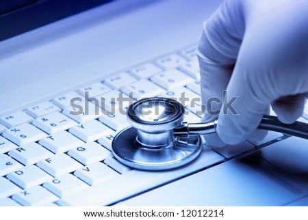 Repair of computer  by a surgeon medic, good technical support symbol.