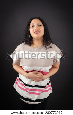 Beautiful woman doing different expressions in different sets of clothes: stomachache