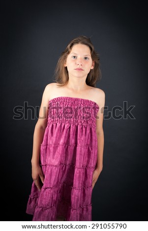 Beautiful girl doing different expressions in different sets of clothes: at attention